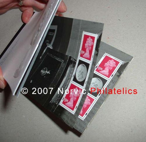 photograph showing Machin Anniversary prestige stamp book with 
pane 2 duplicated.